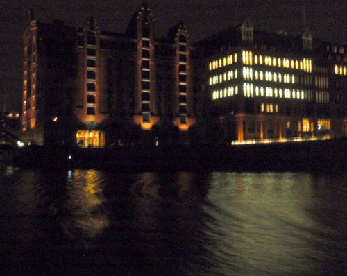 Riverfront properties, Bridges, and city lights.